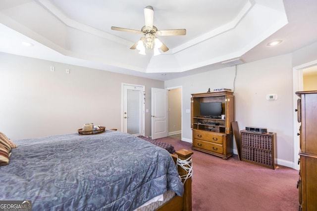 bedroom featuring recessed lighting, a raised ceiling, carpet floors, baseboards, and ceiling fan