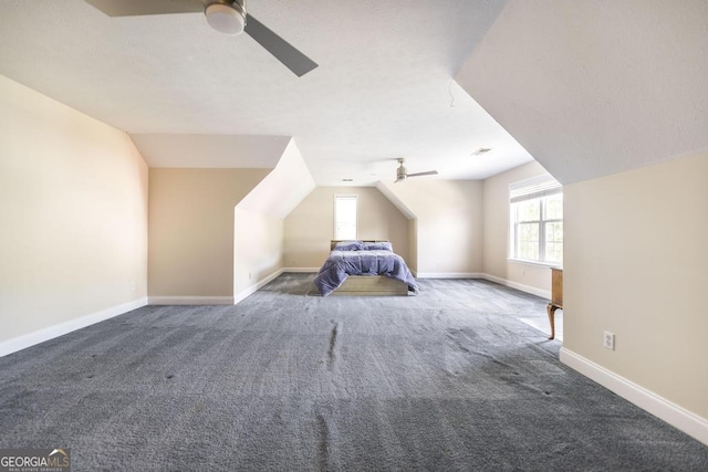 unfurnished bedroom with baseboards, carpet floors, and ceiling fan