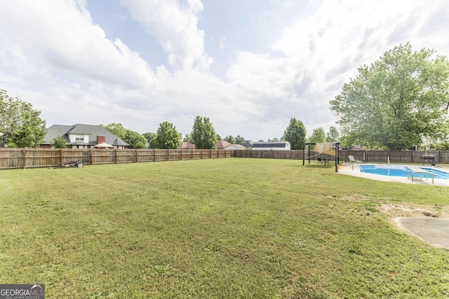 view of yard featuring a fenced backyard and a fenced in pool