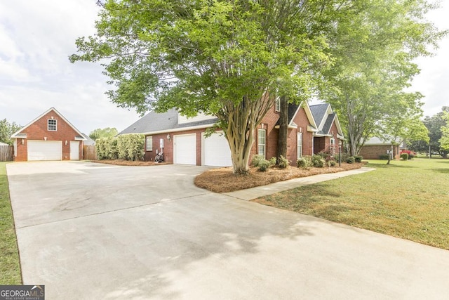 view of front of property with brick siding, a front yard, and concrete driveway