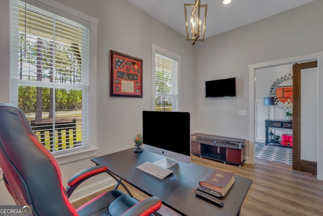 office area featuring recessed lighting, baseboards, wood finished floors, and an inviting chandelier