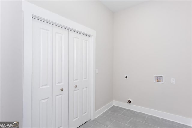 3286 Bachelor St, East Point, GA 30344 - washroom featuring hookup for a washing machine, hookup for an electric dryer, light tile patterned flooring, baseboards, and laundry area