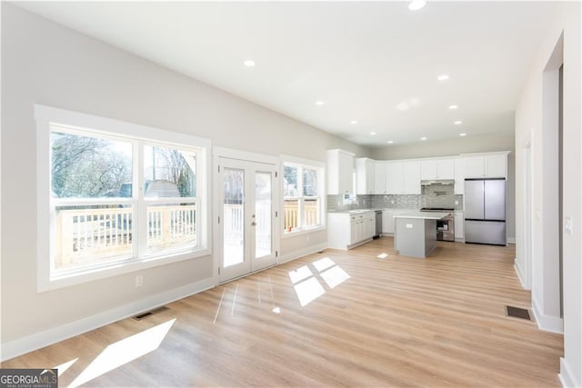 3286 Bachelor St, East Point, GA 30344 - kitchen featuring appliances with stainless steel finishes, visible vents, and a healthy amount of sunlight