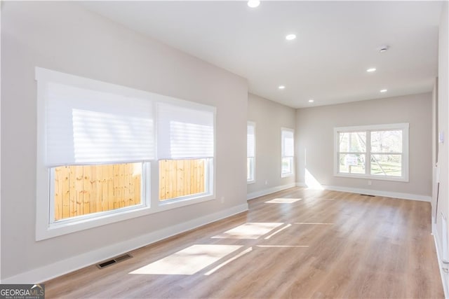 3286 Bachelor St, East Point, GA 30344 - unfurnished living room featuring recessed lighting, light wood-style floors, visible vents, and baseboards