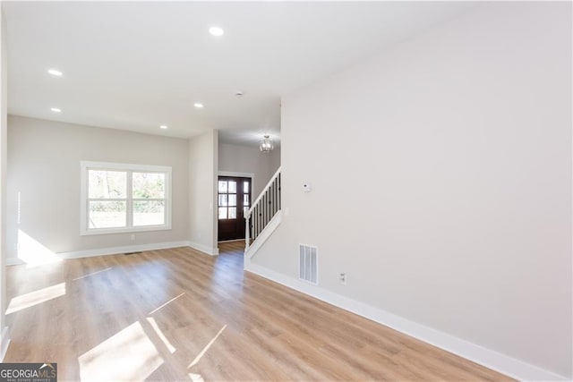 3286 Bachelor St, East Point, GA 30344 - spare room featuring stairway, light wood finished floors, baseboards, visible vents, and recessed lighting