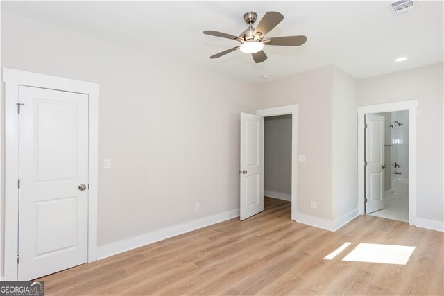 3286 Bachelor St, East Point, GA 30344 - unfurnished bedroom featuring baseboards, ensuite bathroom, visible vents, and light wood-type flooring