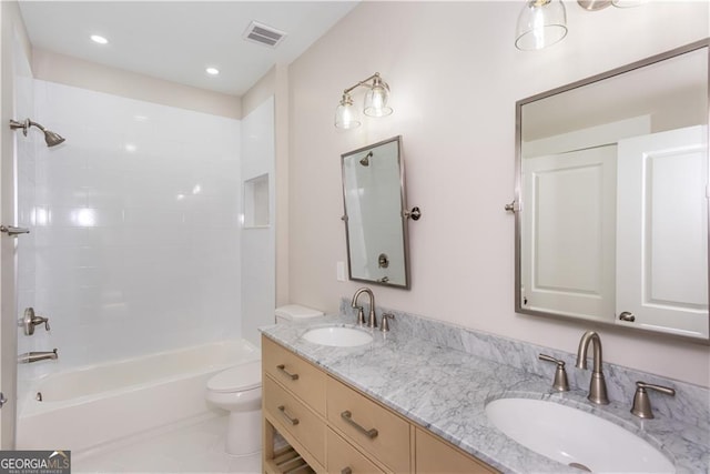 3286 Bachelor St, East Point, GA 30344 - bathroom featuring double vanity, visible vents, toilet, and a sink