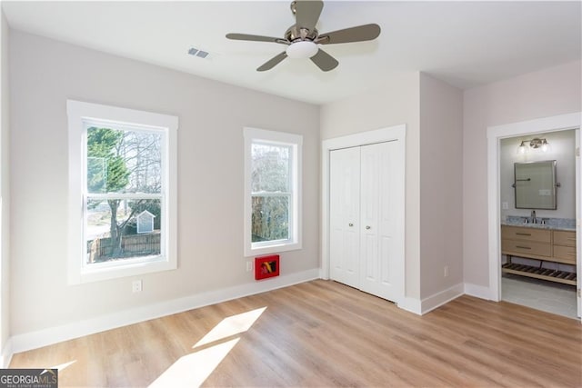 3286 Bachelor St, East Point, GA 30344 - unfurnished bedroom with baseboards, light wood finished floors, visible vents, and a closet