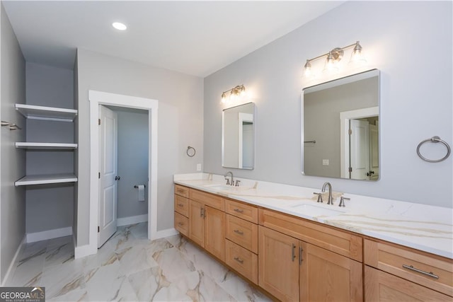 3286 Bachelor St, East Point, GA 30344 - bathroom with double vanity, marble finish floor, baseboards, and a sink