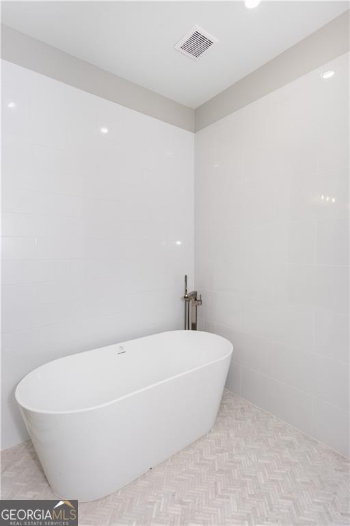 3286 Bachelor St, East Point, GA 30344 - full bathroom with recessed lighting, a soaking tub, and visible vents