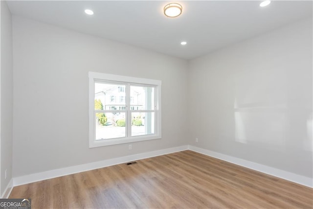 3286 Bachelor St, East Point, GA 30344 - spare room featuring baseboards, wood finished floors, and recessed lighting