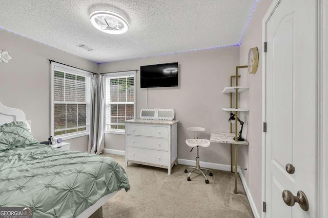 180 Laurel Oaks Ln, Jefferson, GA 30549 - bedroom featuring a textured ceiling, light colored carpet, and baseboards