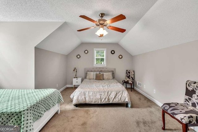 180 Laurel Oaks Ln, Jefferson, GA 30549 - carpeted bedroom featuring baseboards, vaulted ceiling, a ceiling fan, and a textured ceiling