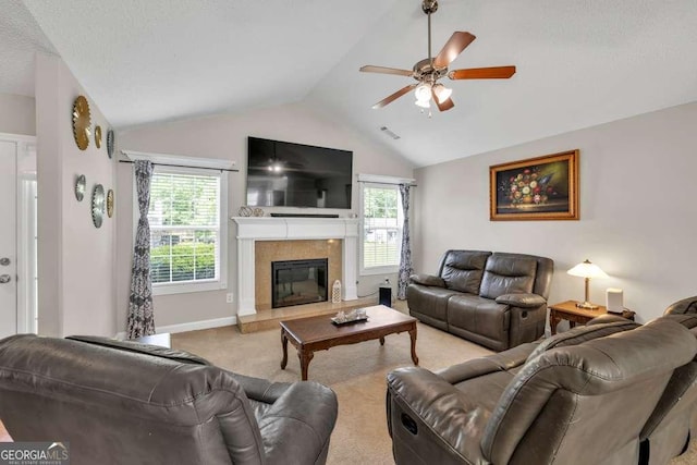 180 Laurel Oaks Ln, Jefferson, GA 30549 - carpeted living room featuring lofted ceiling, ceiling fan, a glass covered fireplace, and baseboards