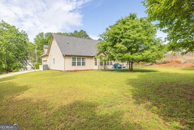180 Laurel Oaks Ln, Jefferson, GA 30549 - rear view of house featuring a yard and central air condition unit