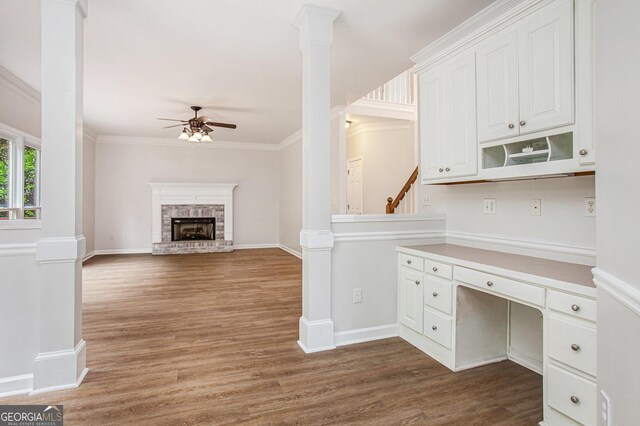 732 Sweet Gum Way, Canton, GA 30115 - interior space featuring dark wood-type flooring, crown molding, baseboards, a brick fireplace, and ceiling fan