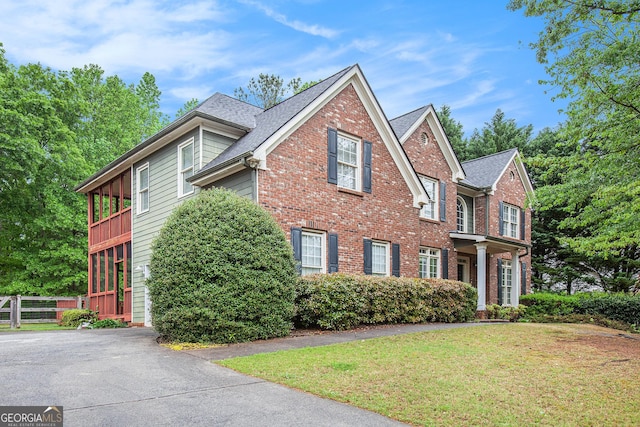 732 Sweet Gum Way, Canton, GA 30115 - view of front of house featuring fence, a front lawn, brick siding, and roof with shingles