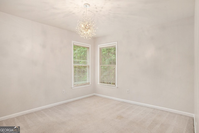 732 Sweet Gum Way, Canton, GA 30115 - empty room with baseboards, light carpet, and an inviting chandelier