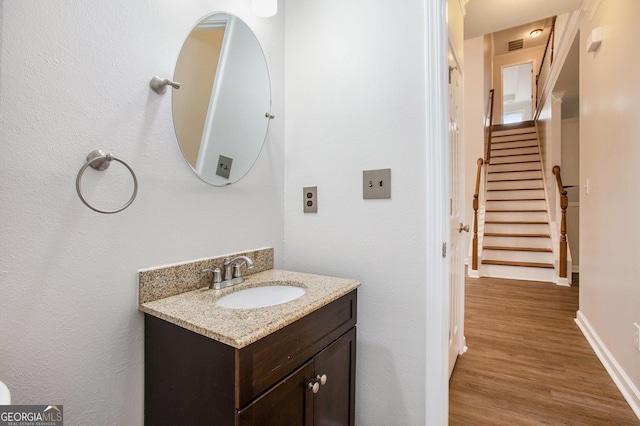 732 Sweet Gum Way, Canton, GA 30115 - bathroom with baseboards, vanity, wood finished floors, and visible vents
