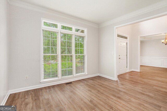 732 Sweet Gum Way, Canton, GA 30115 - spare room with crown molding, wood finished floors, a chandelier, baseboards, and visible vents