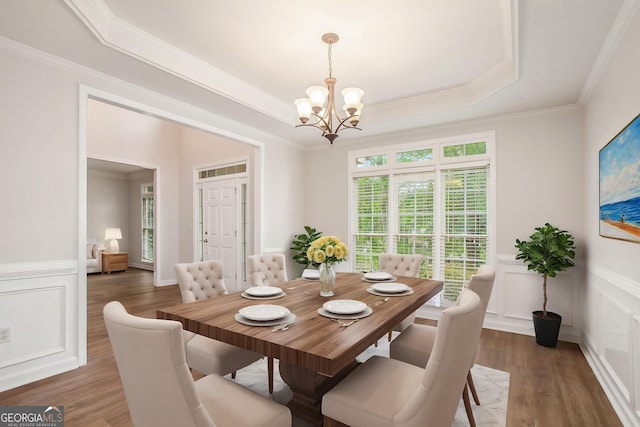 732 Sweet Gum Way, Canton, GA 30115 - dining area featuring a raised ceiling, a notable chandelier, ornamental molding, and a decorative wall