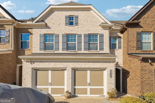 1635 Hampton Oaks Dr, Alpharetta, GA 30004 - view of front facade with an attached garage, driveway, and brick siding