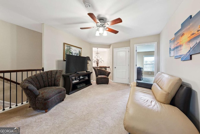 living area with carpet floors and a ceiling fan