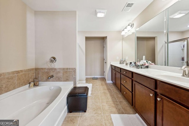 1635 Hampton Oaks Dr, Alpharetta, GA 30004 - bathroom with a garden tub, double vanity, tile patterned flooring, and baseboards