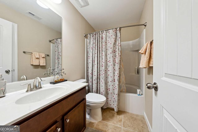 bathroom with vanity, toilet, tile patterned flooring, and visible vents