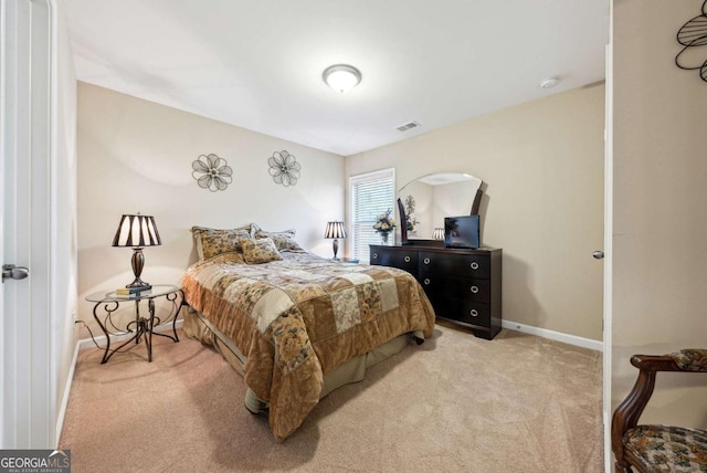 bedroom featuring light carpet, visible vents, and baseboards