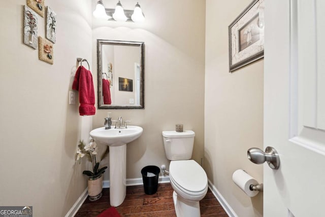 1635 Hampton Oaks Dr, Alpharetta, GA 30004 - bathroom featuring toilet, wood tiled floors, a sink, and baseboards