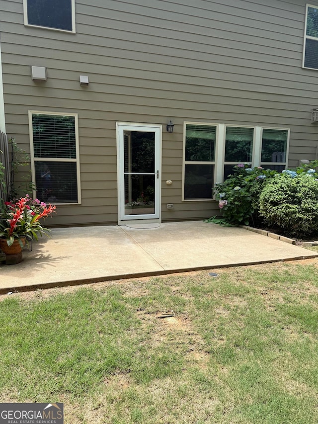1635 Hampton Oaks Dr, Alpharetta, GA 30004 - entrance to property featuring a patio area and a lawn