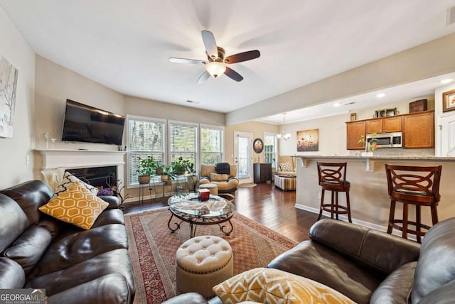1635 Hampton Oaks Dr, Alpharetta, GA 30004 - living room featuring dark wood-type flooring, a ceiling fan, a fireplace, baseboards, and recessed lighting