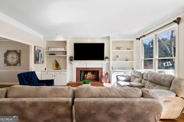 720 Lakeglen Dr, Suwanee, GA 30024 - living area featuring ornamental molding, built in shelves, a brick fireplace, and wood finished floors