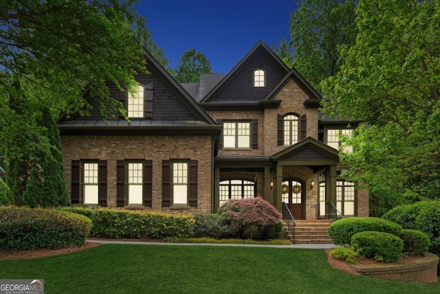 2551 Raintree Dr NE, Atlanta, GA 30345 - craftsman-style house featuring brick siding, a front yard, and a standing seam roof