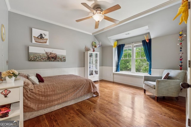 2551 Raintree Dr NE, Atlanta, GA 30345 - bedroom featuring crown molding, wood finished floors, a wainscoted wall, radiator, and visible vents