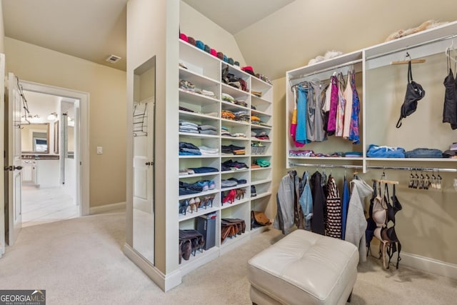 2551 Raintree Dr NE, Atlanta, GA 30345 - walk in closet with visible vents and carpet flooring