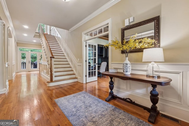 2551 Raintree Dr NE, Atlanta, GA 30345 - entryway featuring a decorative wall, visible vents, crown molding, and french doors