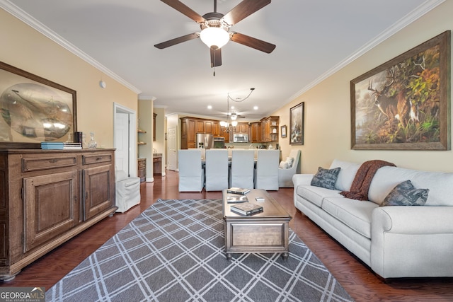living room with dark wood-type flooring, ceiling fan, and crown molding