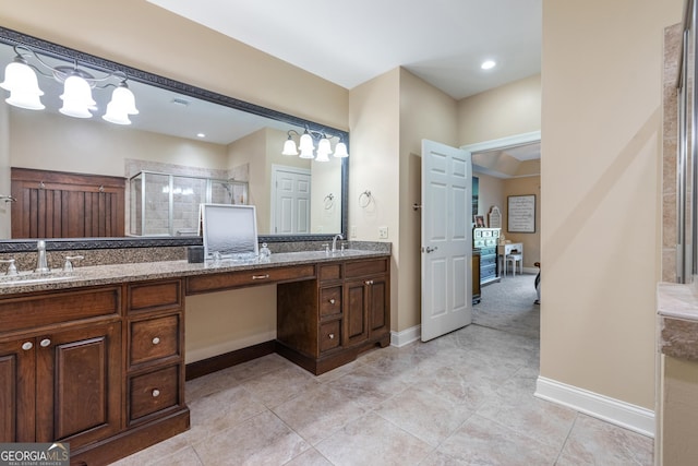 full bath with a sink, double vanity, and a stall shower