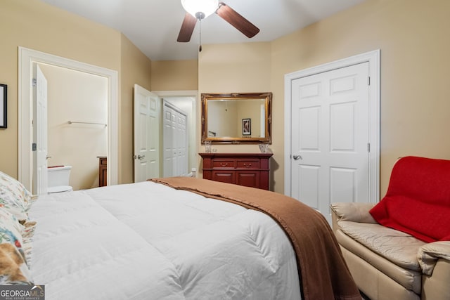 bedroom featuring connected bathroom and a ceiling fan
