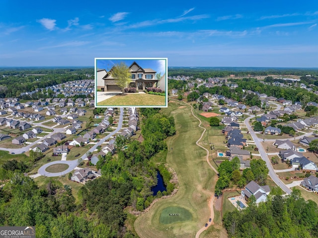 birds eye view of property featuring a residential view and golf course view