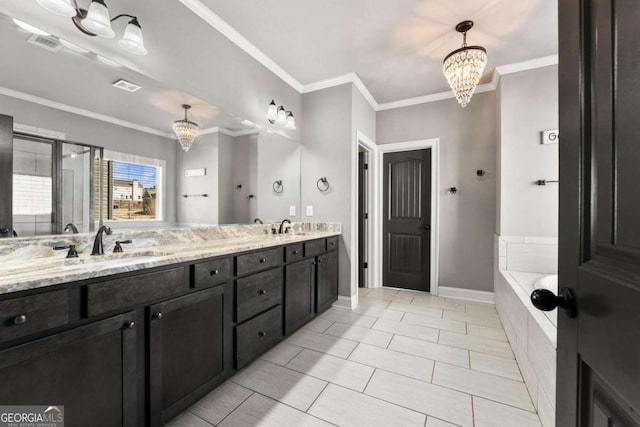 full bathroom featuring a sink, double vanity, a stall shower, visible vents, and an inviting chandelier