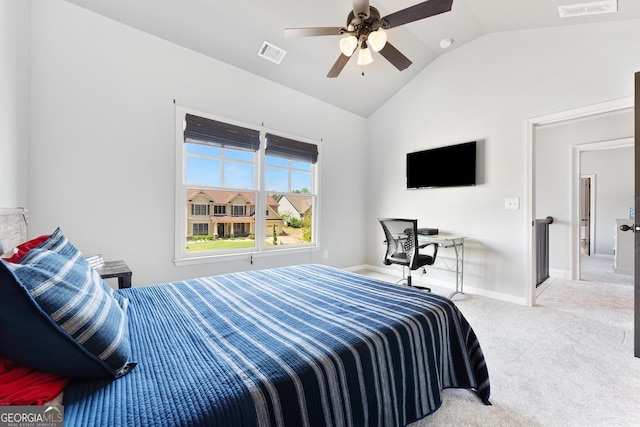 bedroom featuring baseboards, lofted ceiling, visible vents, and carpet