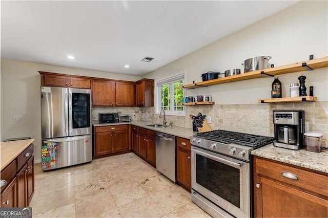 72 Griggs St SW, Marietta, GA 30064 - kitchen featuring appliances with stainless steel finishes, backsplash, open shelves, light stone counters, and recessed lighting