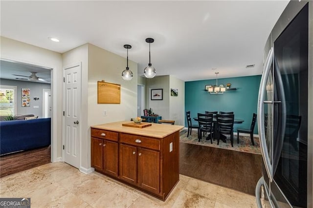72 Griggs St SW, Marietta, GA 30064 - kitchen featuring freestanding refrigerator, a chandelier, hanging light fixtures, and light countertops