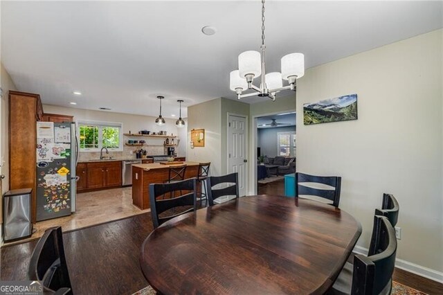 72 Griggs St SW, Marietta, GA 30064 - dining space featuring a chandelier, wood finished floors, and ceiling fan