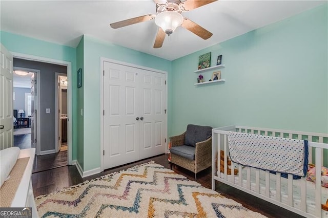 72 Griggs St SW, Marietta, GA 30064 - bedroom featuring a closet, wood finished floors, a crib, and ceiling fan