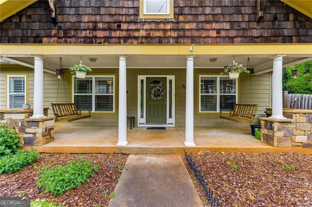 72 Griggs St SW, Marietta, GA 30064 - doorway to property featuring covered porch