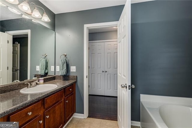 72 Griggs St SW, Marietta, GA 30064 - bathroom featuring tile patterned floors, vanity, and a garden tub